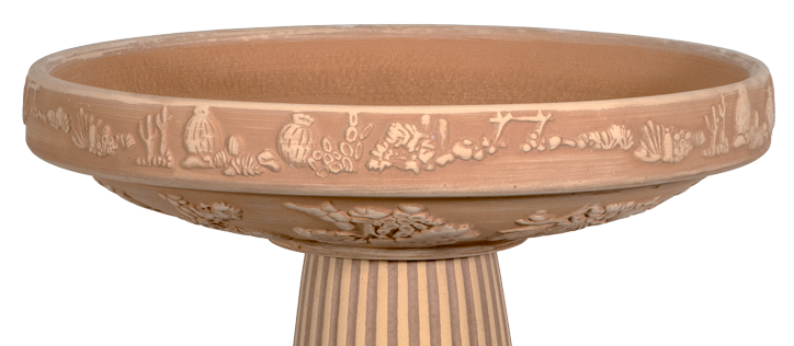 desert themed birdbath top with local flora all around the rim and underside