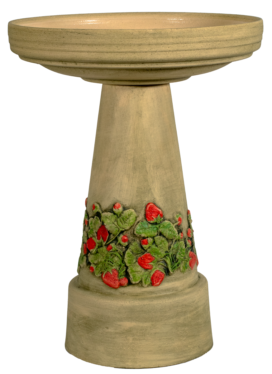 Decorative bird bath with strawberry patch design on a white background