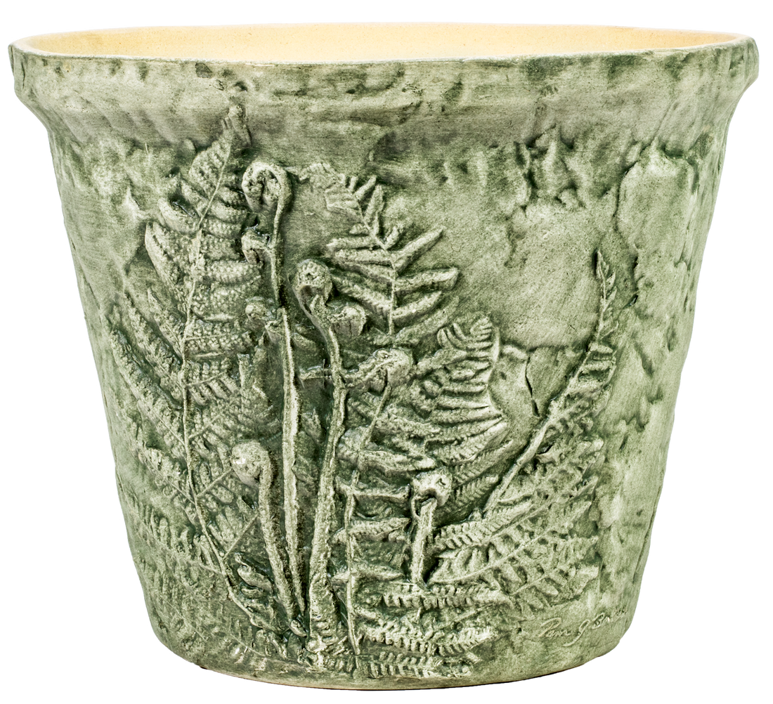 large green aged ceramic planter with ferns embedded 