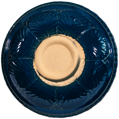 Ceramic blue birdbath top with large leaf pattern view of back