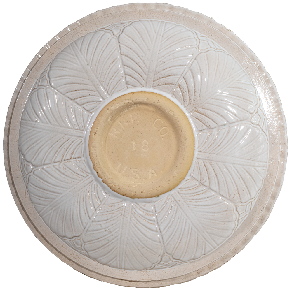 Ceramic white birdbath top with large leaf pattern view of back