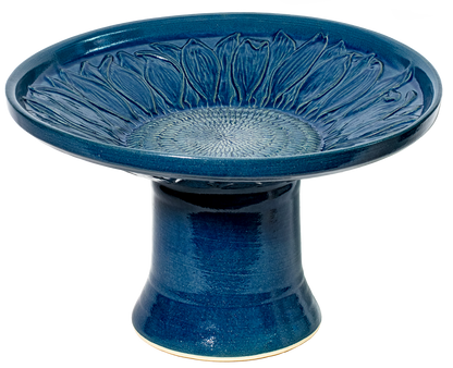 short ceramic sunflower birdbath set in blue glaze