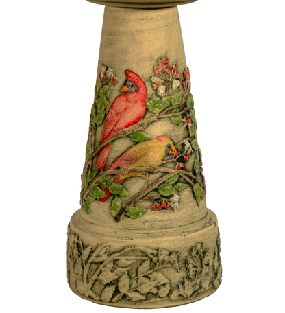 Decorative bird bath with cardinals on a white background