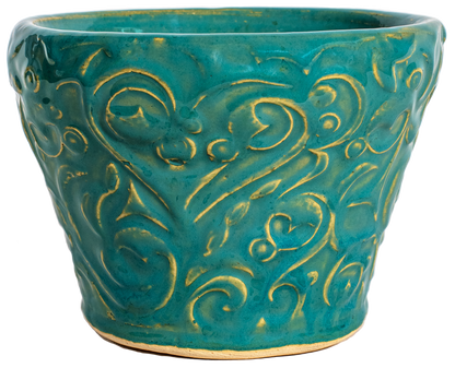 small ceramic planters in turquoise glaze with swirl design