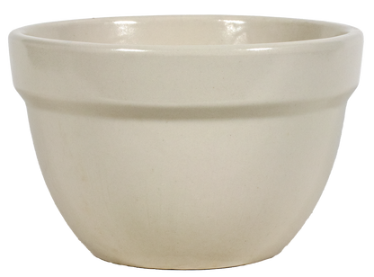 Beige ceramic kitchen mixing bowl on a white background