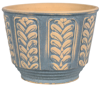 A round ceramic planter pot with a textured blue-gray exterior featuring embossed vertical leafy patterns and a natural beige interior.
