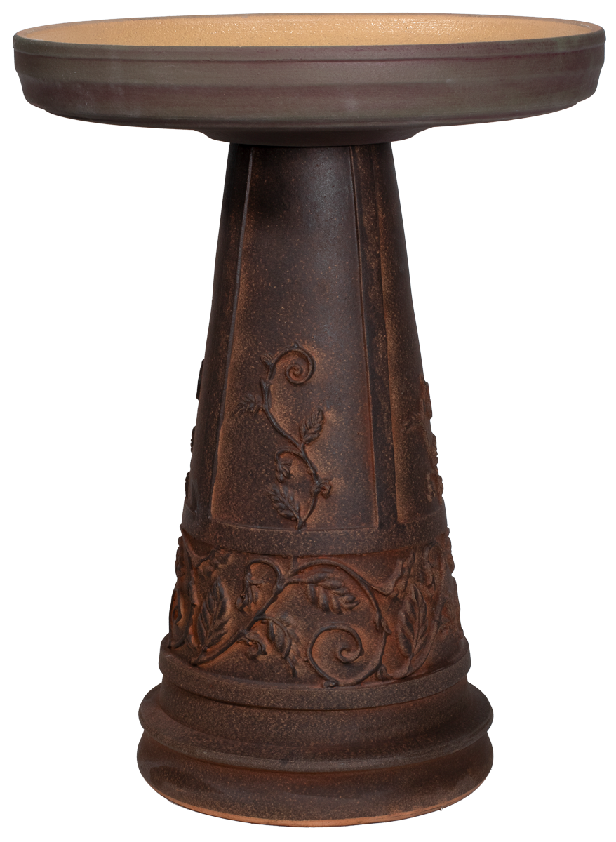Decorative brown pedestal table with intricate iron works designs on a white background
