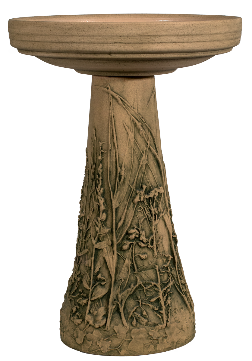 Decorative bird bath with naturalistic flower and grasses design on a white background