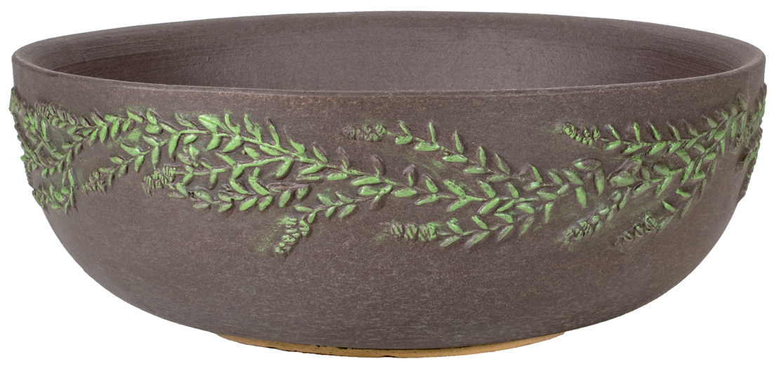 large shallow brown planter bowl with hand painted wreath design