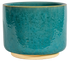 medium turquoise ceramic cylinder planter in a modern style with small pedestal foot