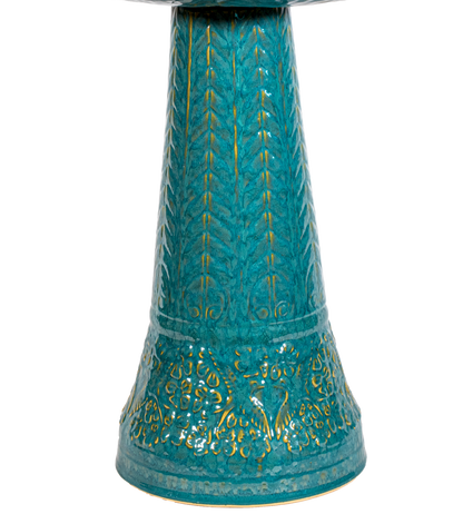 ceramic turquoise birdbath pedestal with birds flowers and a chevron design