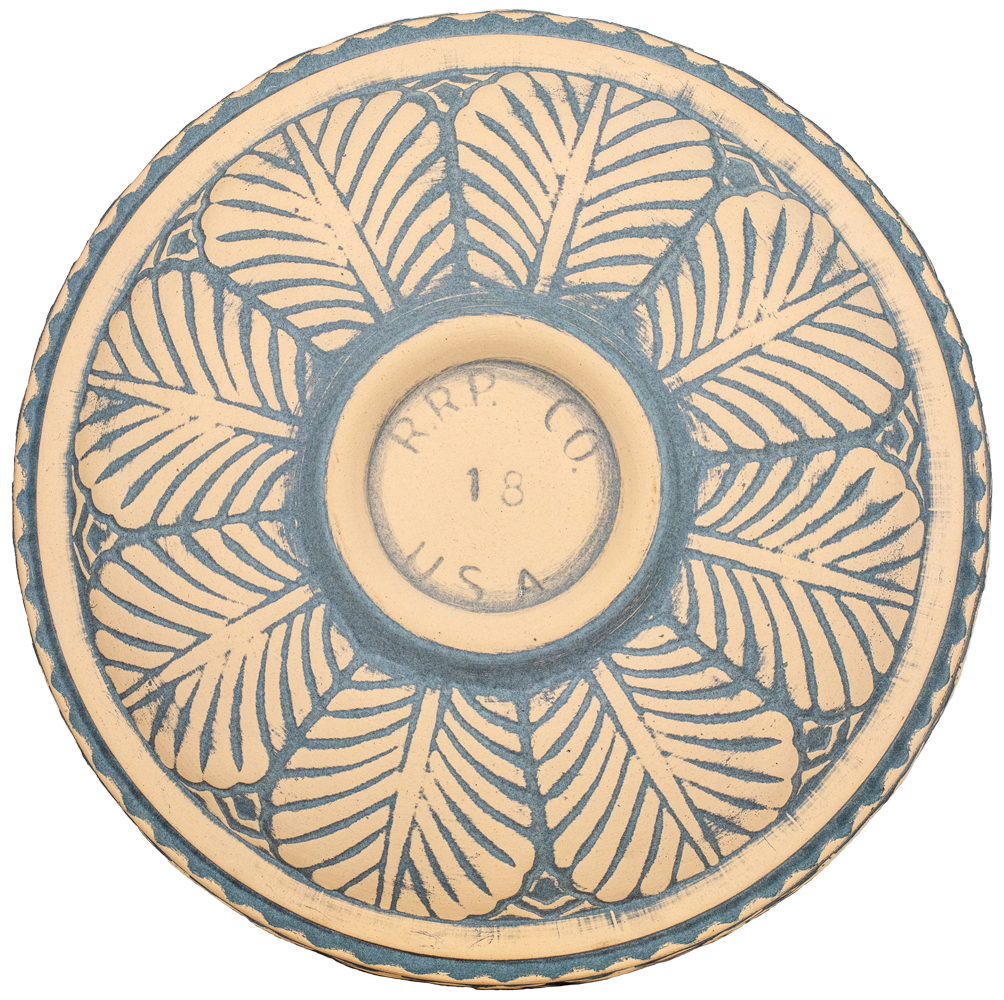 ceramic tan and light blue natural birdbath top view from behind with large leaf pattern