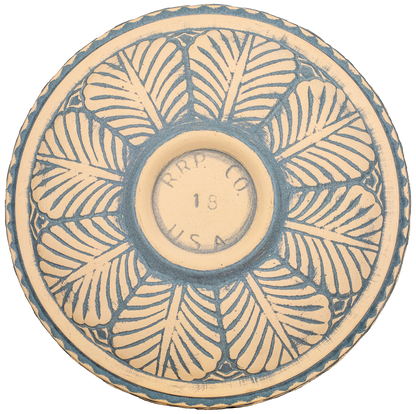 ceramic tan and light blue natural birdbath top view from behind with large leaf pattern