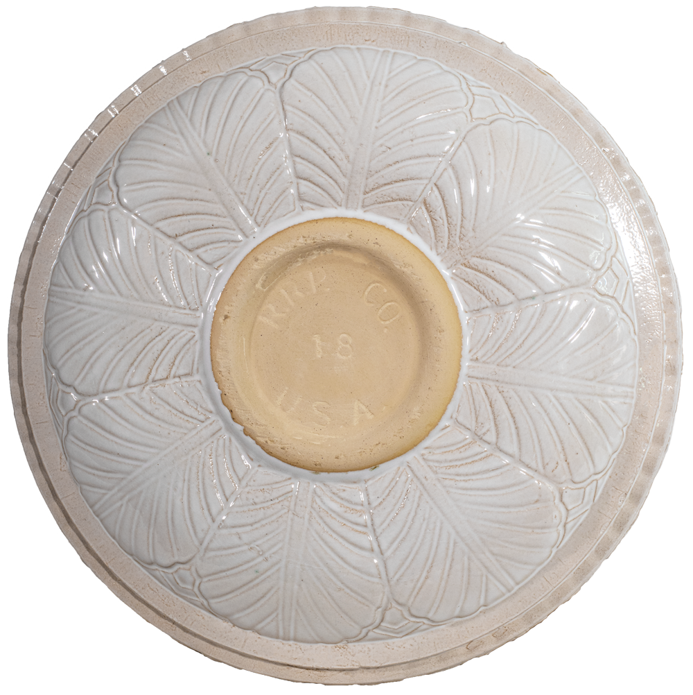 ceramic white birdbath top view from behind with large leaf pattern