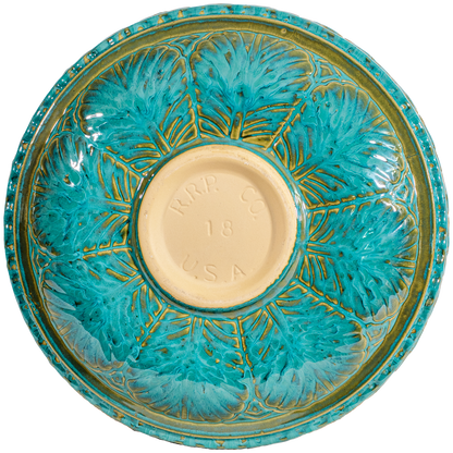 Ceramic turquoise birdbath top with large leaf pattern view of back