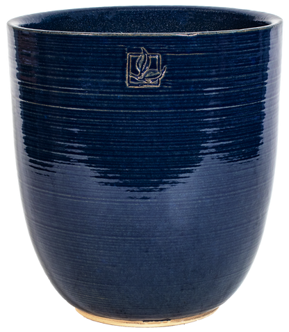 tall rounded blue ceramic planter with a leaf stamp
