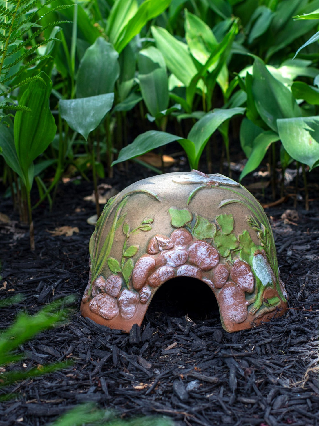 Small hand painted ceramic toad house with river stones leaves and a frog